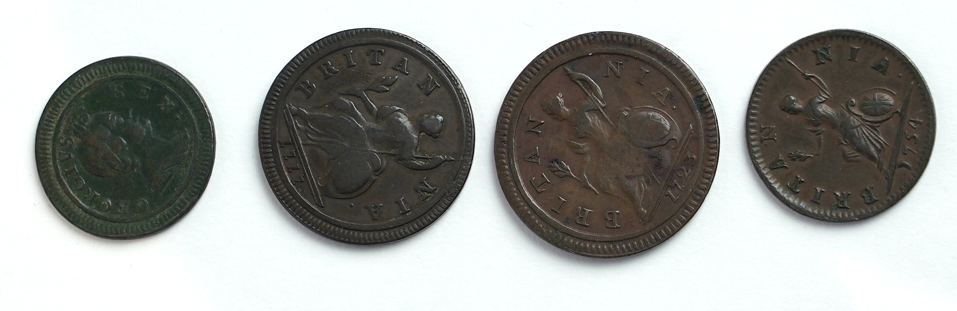 British farthings and halfpennies, Georgian period; two George I halfpenny coins, 1717, graffiti initials each side of portrait bust otherwise fine and 1723, about fine, three George I farthings, including 1719, fine, tw